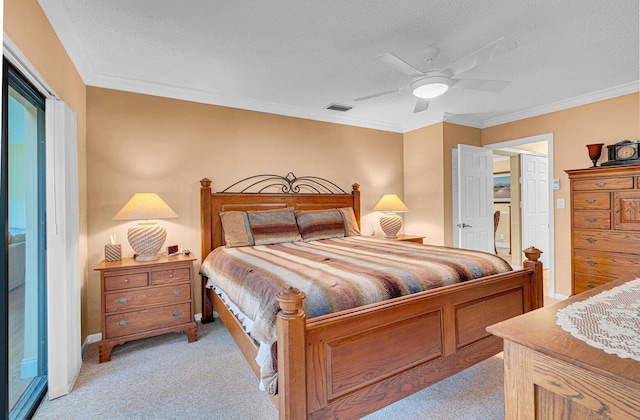 bedroom with a textured ceiling, light colored carpet, ceiling fan, and crown molding