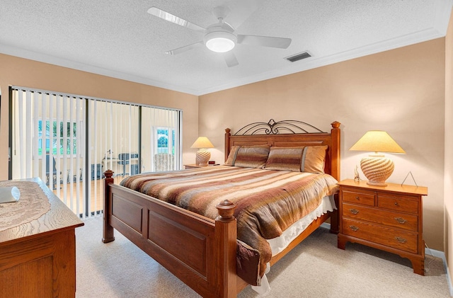 bedroom featuring access to exterior, ceiling fan, light carpet, and a textured ceiling