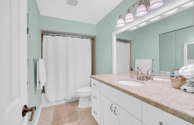 full bathroom with tile patterned floors, vanity, toilet, and shower / tub combo with curtain