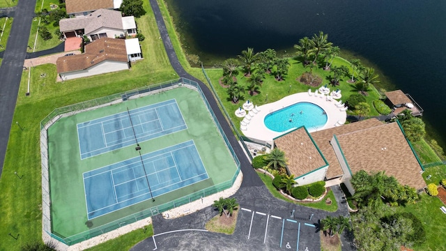 birds eye view of property with a water view