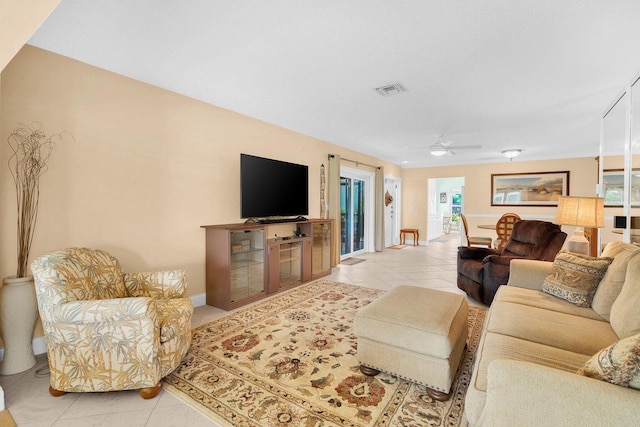 tiled living room featuring ceiling fan