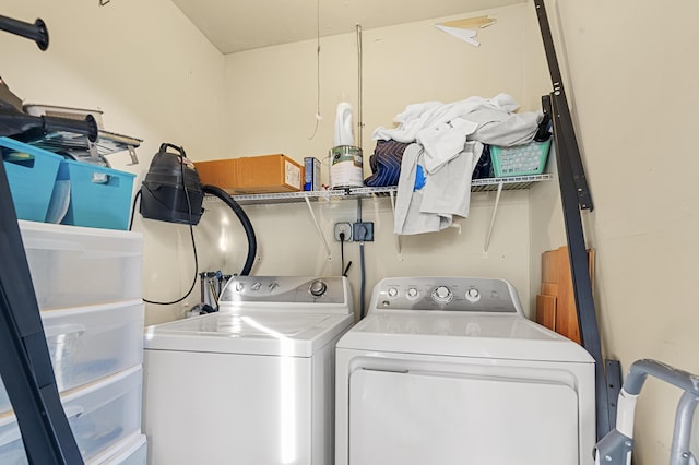 washroom featuring washer and clothes dryer