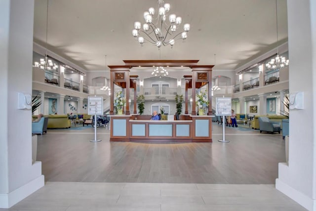 welcome area featuring a chandelier