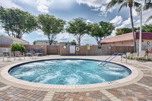 view of swimming pool with a patio