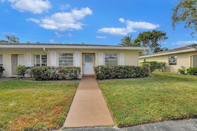 ranch-style home with a front yard