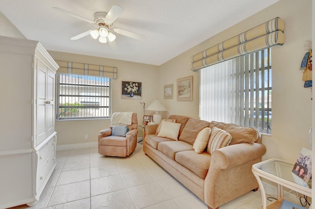 living room featuring light tile patterned floors and ceiling fan