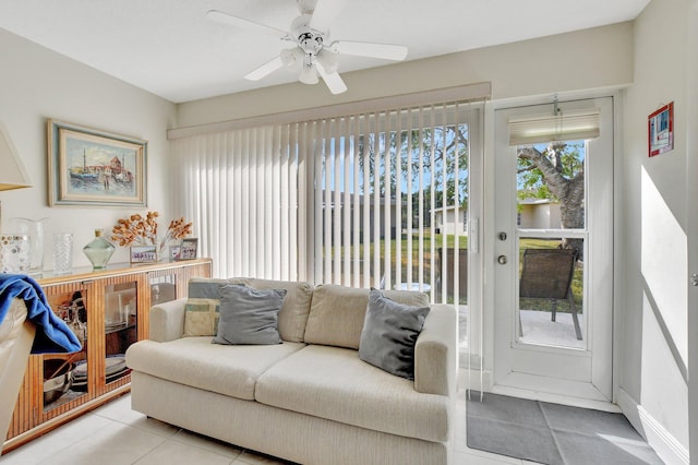 living room with light tile patterned floors and ceiling fan