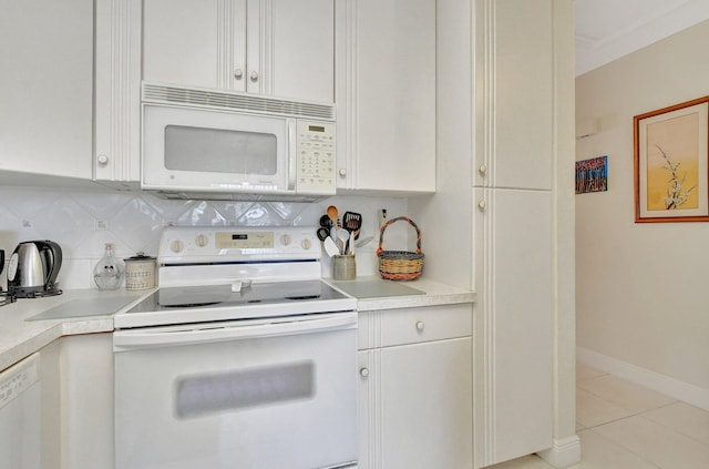 kitchen with tasteful backsplash, white cabinetry, light tile patterned flooring, and white appliances