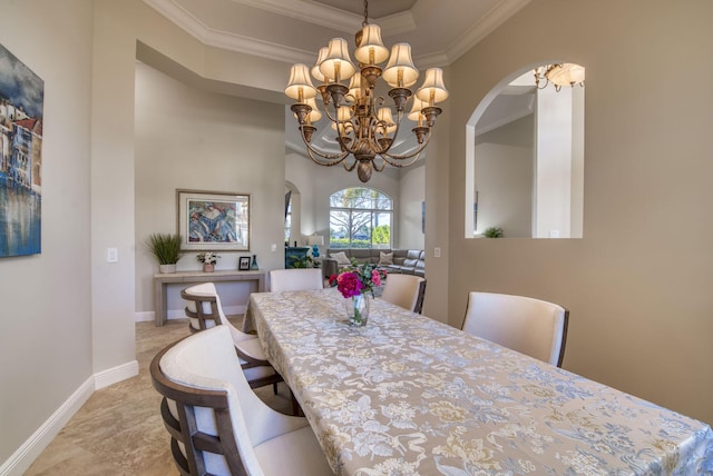 dining space with crown molding and a notable chandelier