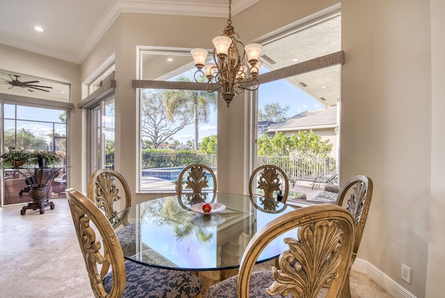 dining room featuring ceiling fan with notable chandelier and ornamental molding