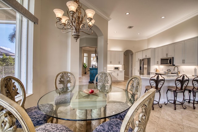 7541 Monte Verde Ln, West Palm Beach, FL 33412 - dining room with arched walkways, a chandelier, crown molding, a towering ceiling, and recessed lighting