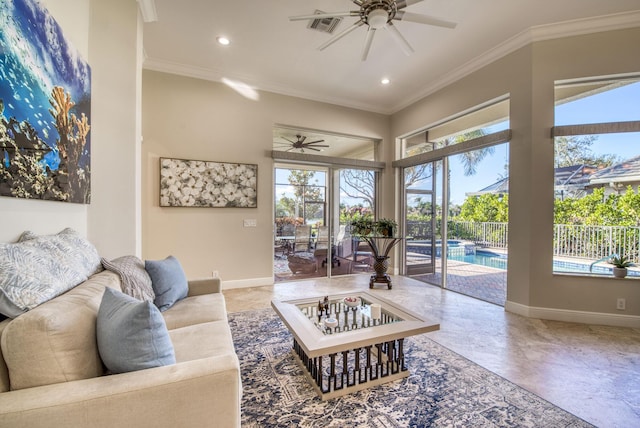 living room with ceiling fan and ornamental molding