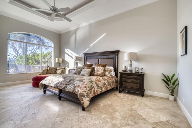 bedroom featuring ceiling fan, crown molding, and a tray ceiling