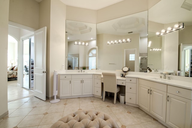 bathroom with tile patterned flooring, a high ceiling, plenty of natural light, and walk in shower