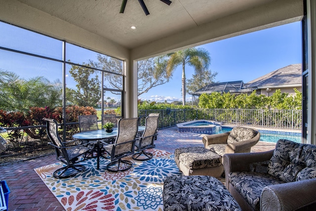 exterior space with ceiling fan and a pool with hot tub