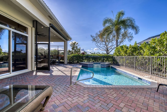 view of swimming pool featuring an in ground hot tub and a patio