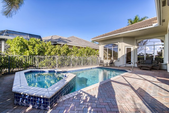 7541 Monte Verde Ln, West Palm Beach, FL 33412 - view of pool featuring fence, a patio, and a pool with connected hot tub