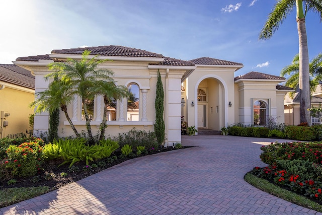 7541 Monte Verde Ln, West Palm Beach, FL 33412 - mediterranean / spanish home with stucco siding and decorative driveway
