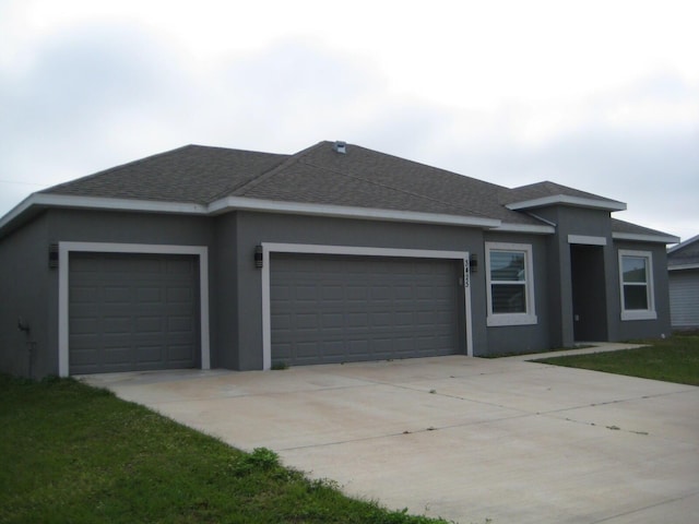 ranch-style house featuring a garage