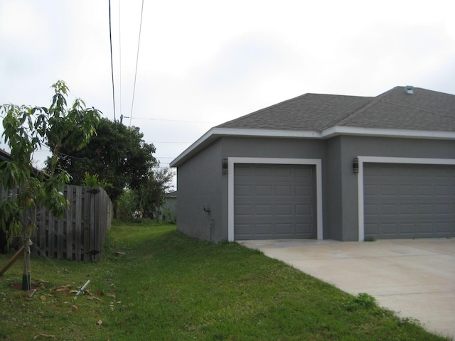 garage with a yard