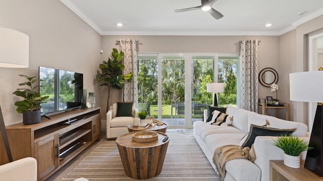 living room featuring ceiling fan, crown molding, and hardwood / wood-style floors