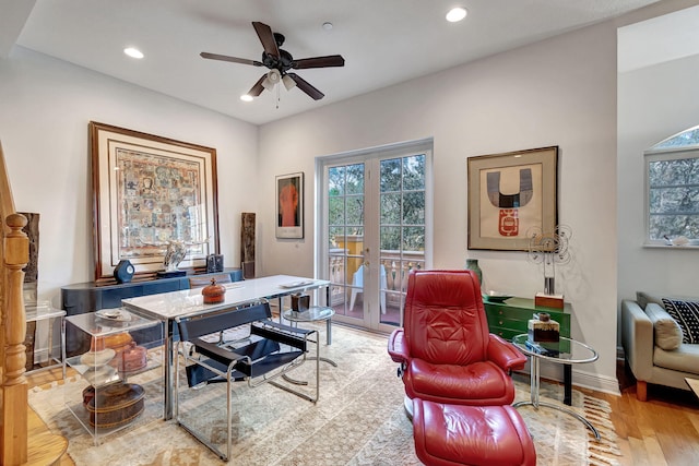 office space featuring ceiling fan, french doors, and light wood-type flooring