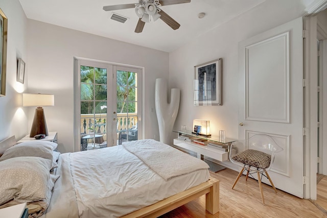 bedroom featuring french doors, light wood-type flooring, access to outside, and ceiling fan