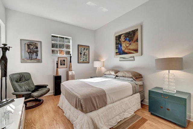 bedroom with light wood-type flooring