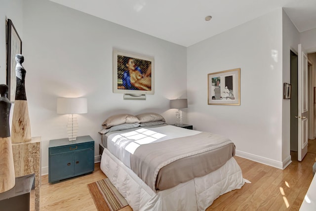 bedroom with light hardwood / wood-style floors