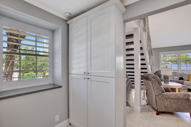 kitchen featuring white cabinetry and light tile patterned floors