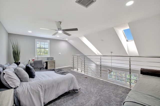 carpeted bedroom with ceiling fan and lofted ceiling