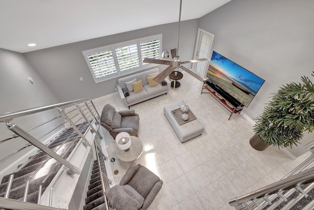 tiled living room featuring ceiling fan