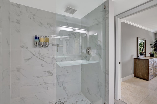 bathroom featuring a tile shower and crown molding