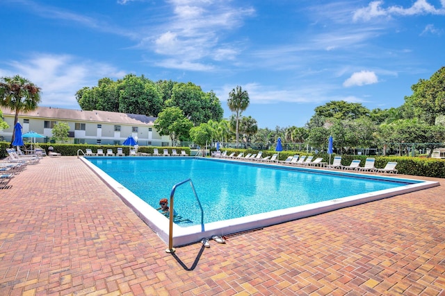 view of swimming pool featuring a patio