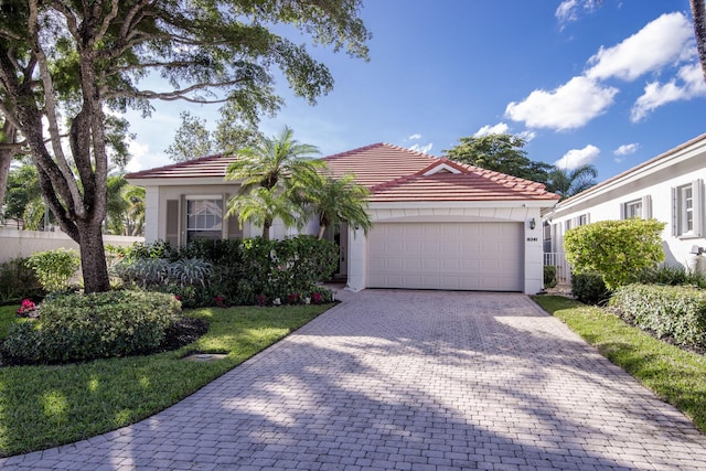 mediterranean / spanish-style home featuring a garage