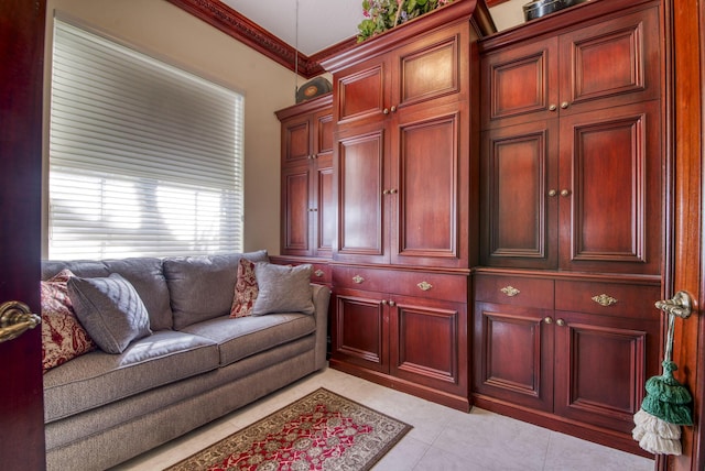 living room with crown molding and light tile patterned flooring