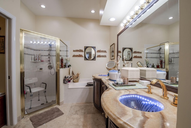 bathroom with tile patterned floors, vanity, and a shower with shower door