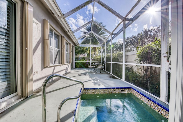 view of pool with a lanai