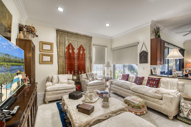 living room featuring ceiling fan and ornamental molding