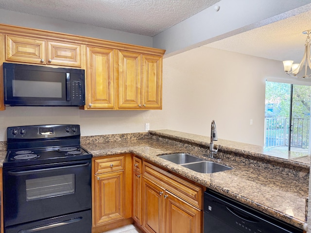 kitchen featuring black appliances, a textured ceiling, sink, and an inviting chandelier