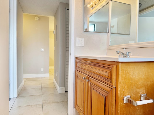 bathroom with vanity and tile patterned floors