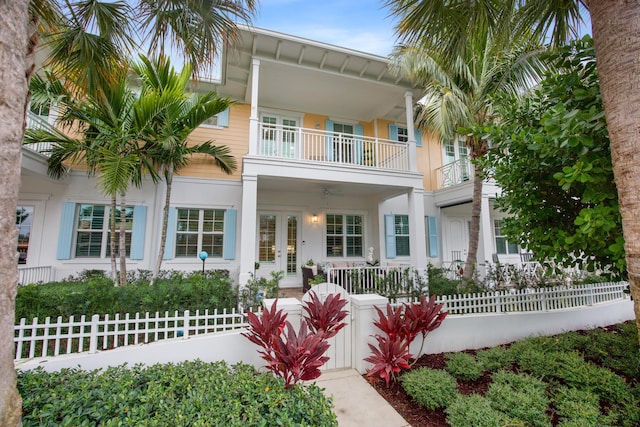 view of front of house with a porch and a balcony