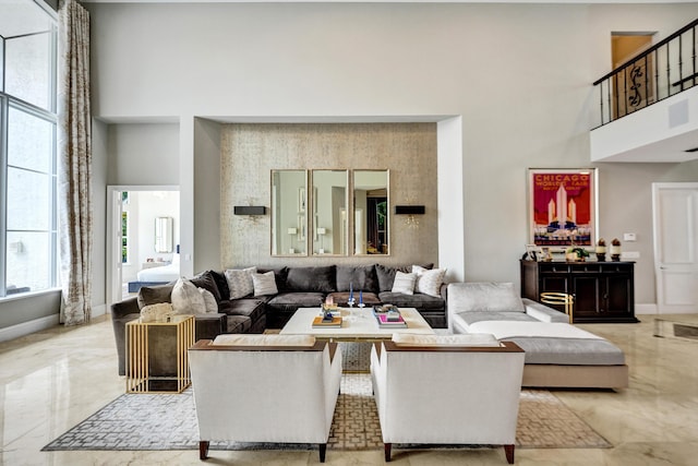 living room with a towering ceiling