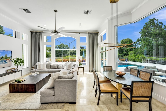 sunroom with ceiling fan