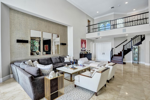 living room with crown molding and a high ceiling