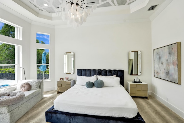 bedroom with coffered ceiling, ornamental molding, light carpet, and multiple windows