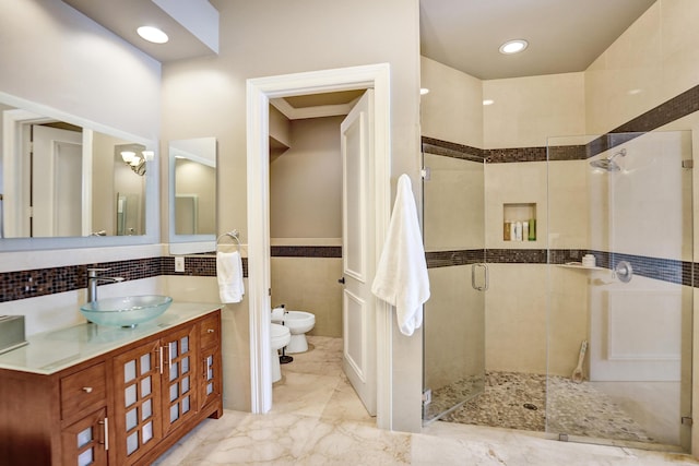 bathroom featuring vanity, a bidet, toilet, tile walls, and an enclosed shower