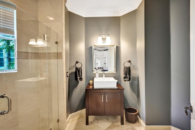 bathroom featuring crown molding, vanity, and a shower with shower door