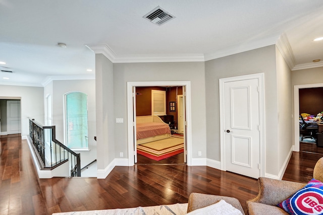 interior space with crown molding and dark wood-type flooring