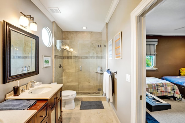 bathroom featuring toilet, vanity, a shower with shower door, and ornamental molding